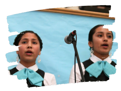 Northern California students singing mariachi folkloric female singer in white blouse, black vest and teal bow tie.
